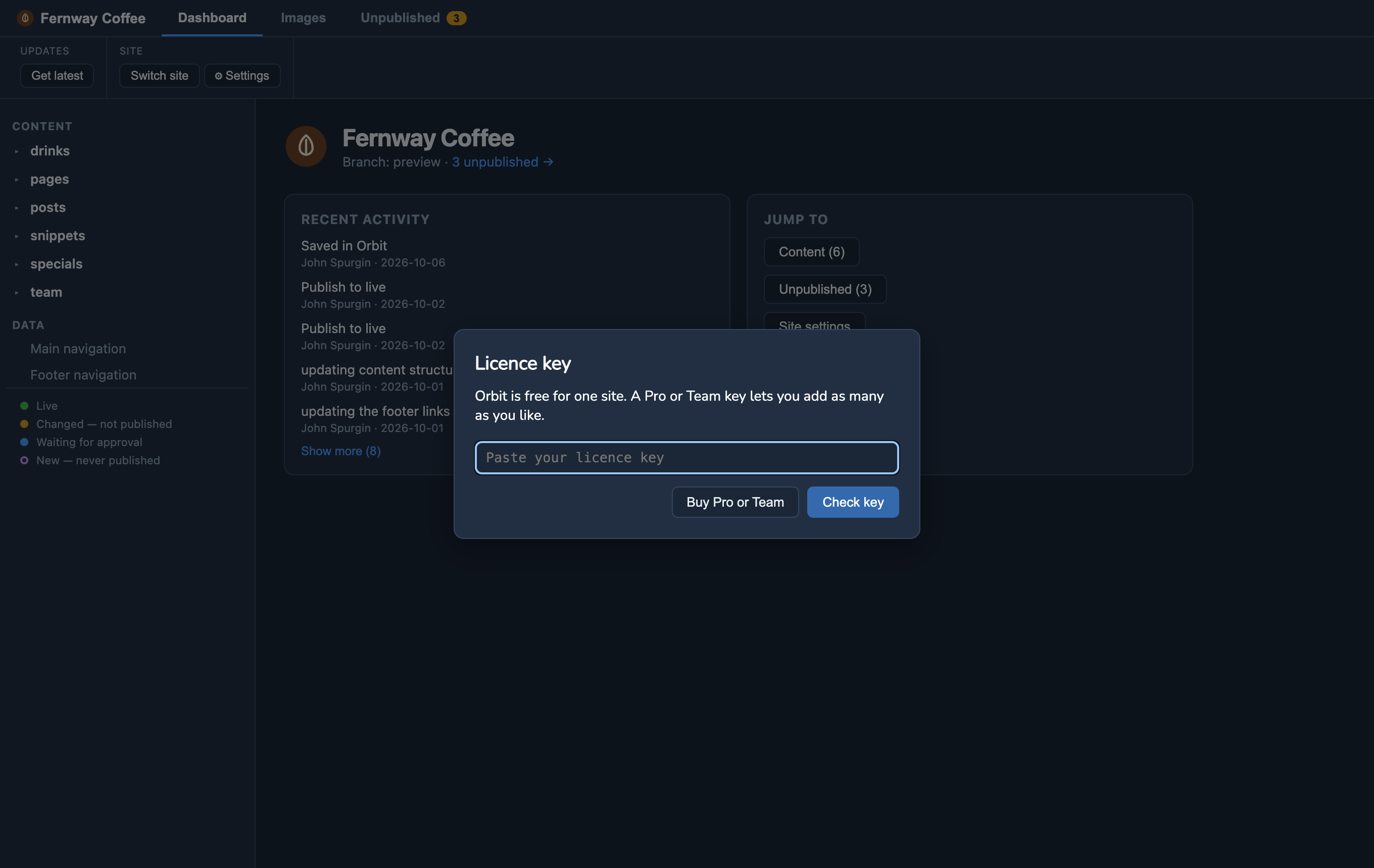 Orbit MD's Licence key window over the dashboard: a note that Orbit is free for one site, a box to paste the key, and Buy Pro or Team and Check key buttons